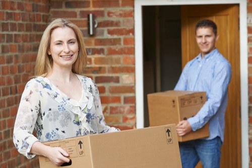 Professional packers organizing boxes in a storage facility