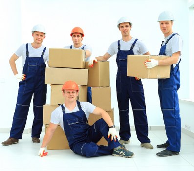 Professional movers handling furniture during a home move